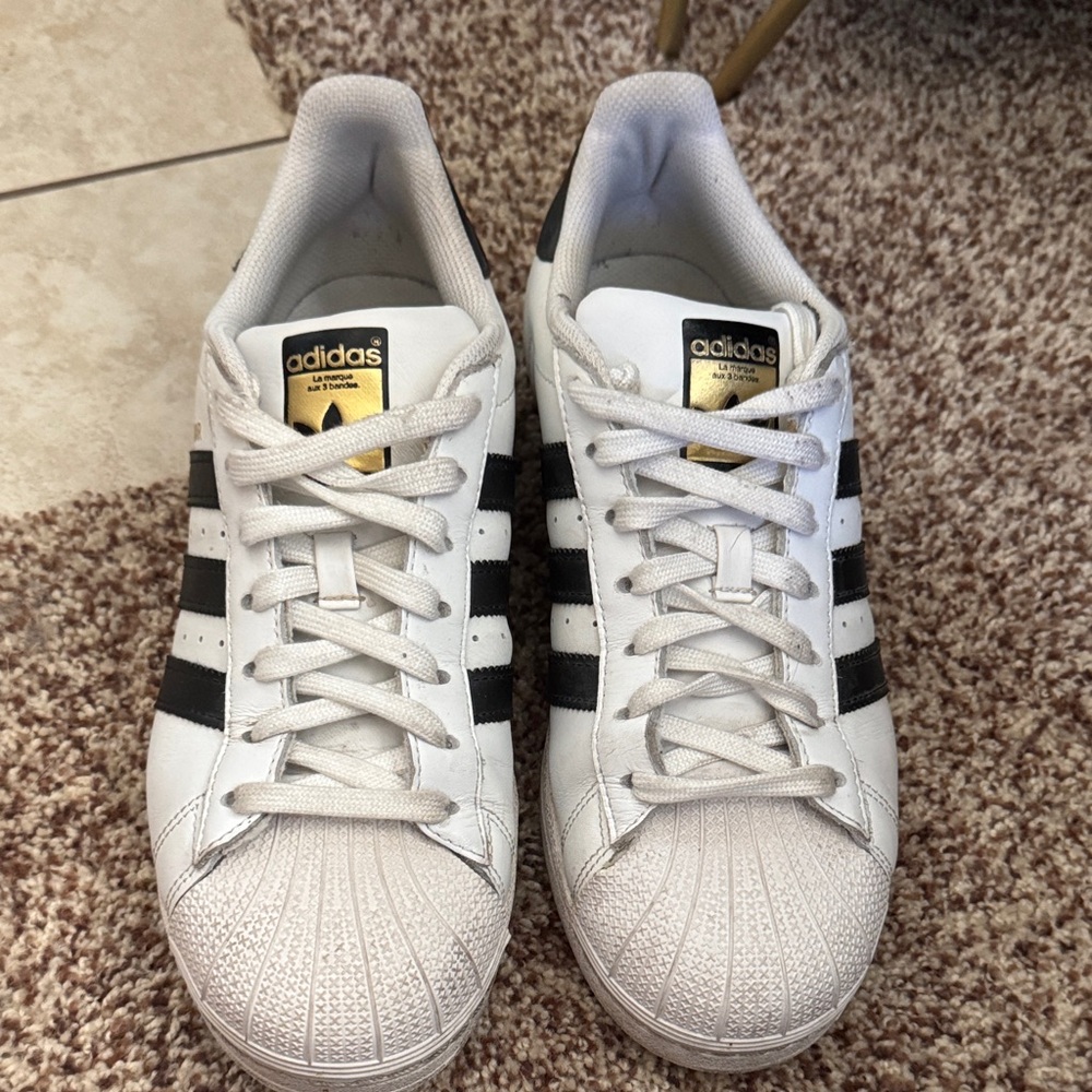Adidas Classic White and Black Sneakers with Gold Accents